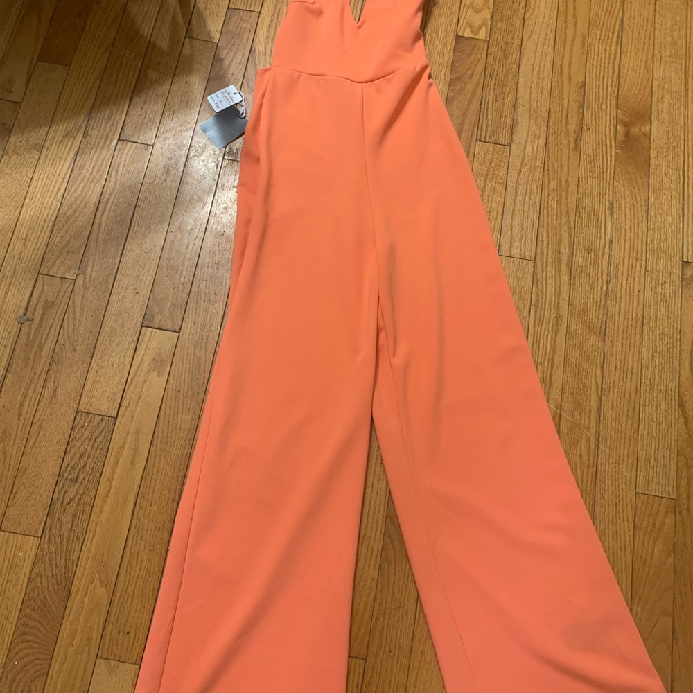 Bebe Cross Back Wide Leg Jumpsuit peach pink color